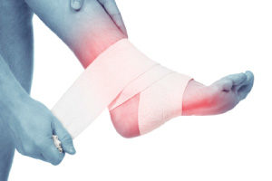 Image of someone taping their injured foot