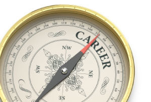 Photo of a compass, with the needle pointing to a Career direction