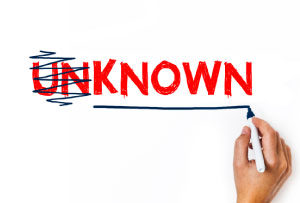 Photo of someone changing the word unknown to known - as a metaphor for having a strong personal career brand