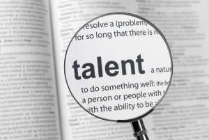 Magnifying glass over the word 'talent' in a dictionary (related to career strengths and skills)